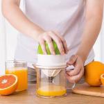 .  Mini lemon and orange juicer with hand-press juicing cup